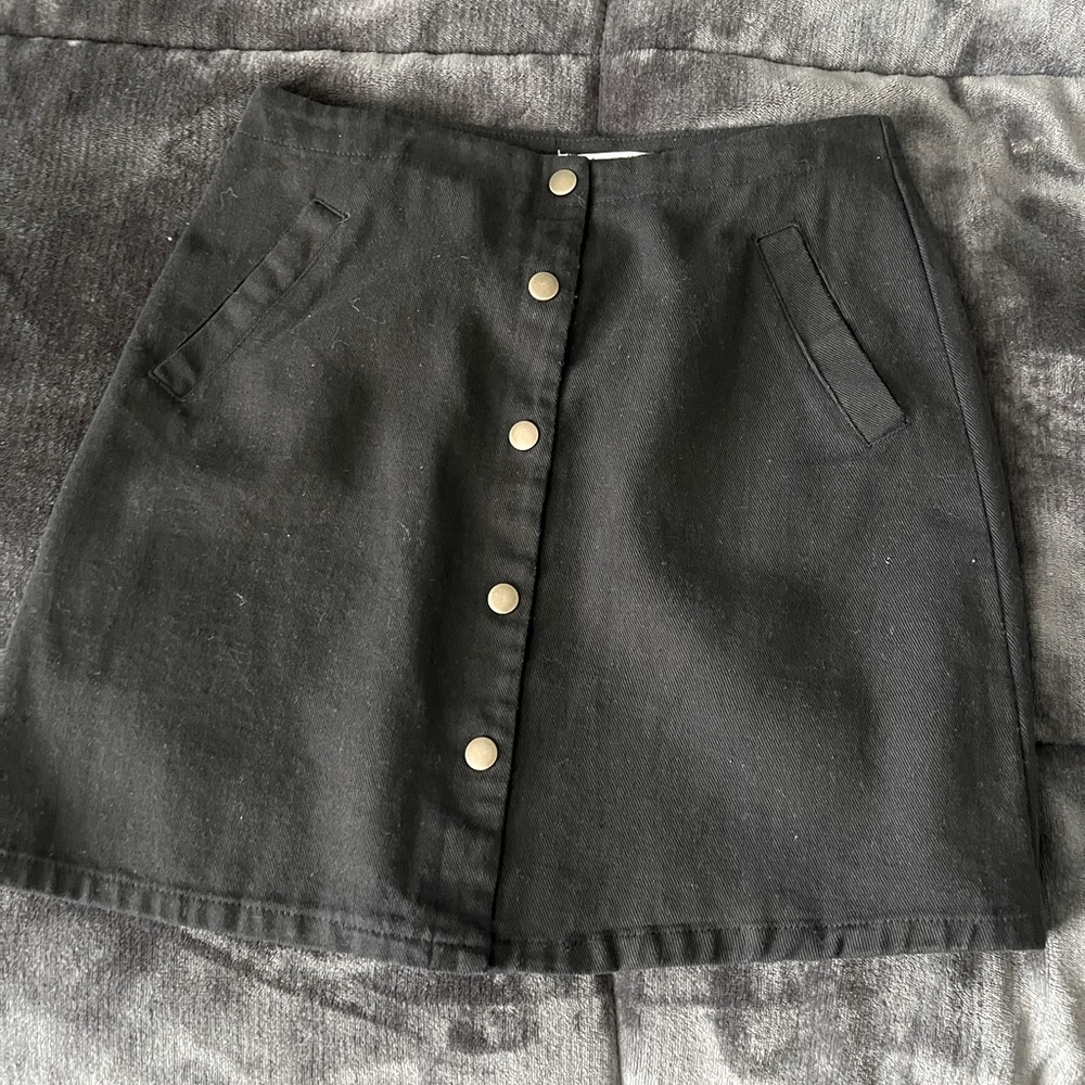 Francesca’s small, black button skirt